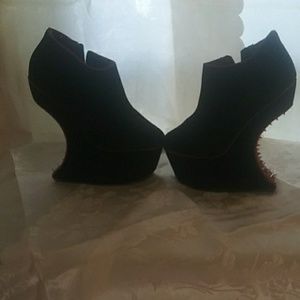 Black with red trim side zip up boot like.